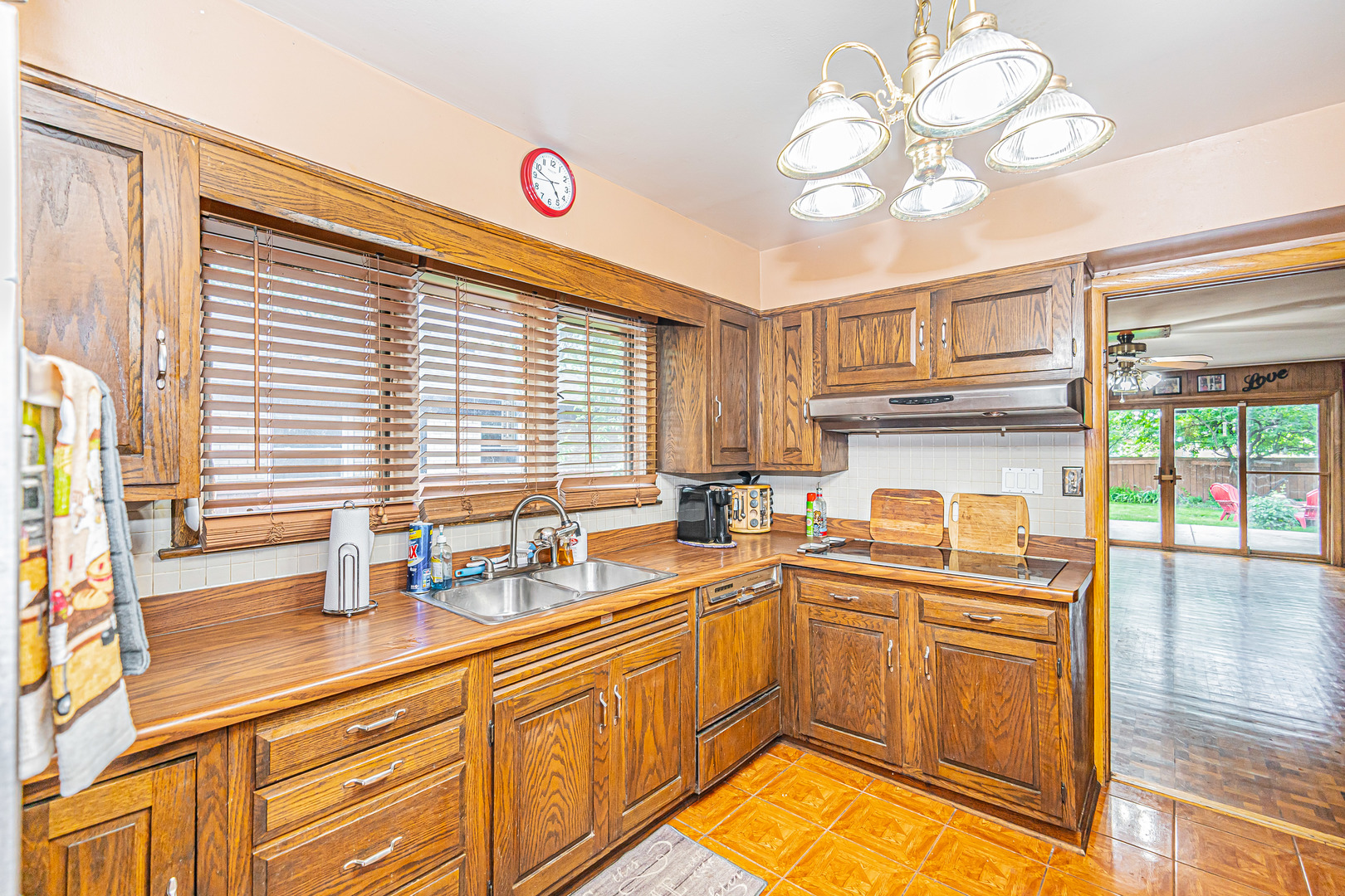 2256 North Home Avenue Park Ridge, IL 60068 - Photo 10 of 40 a kitchen with a sink cabinets and window