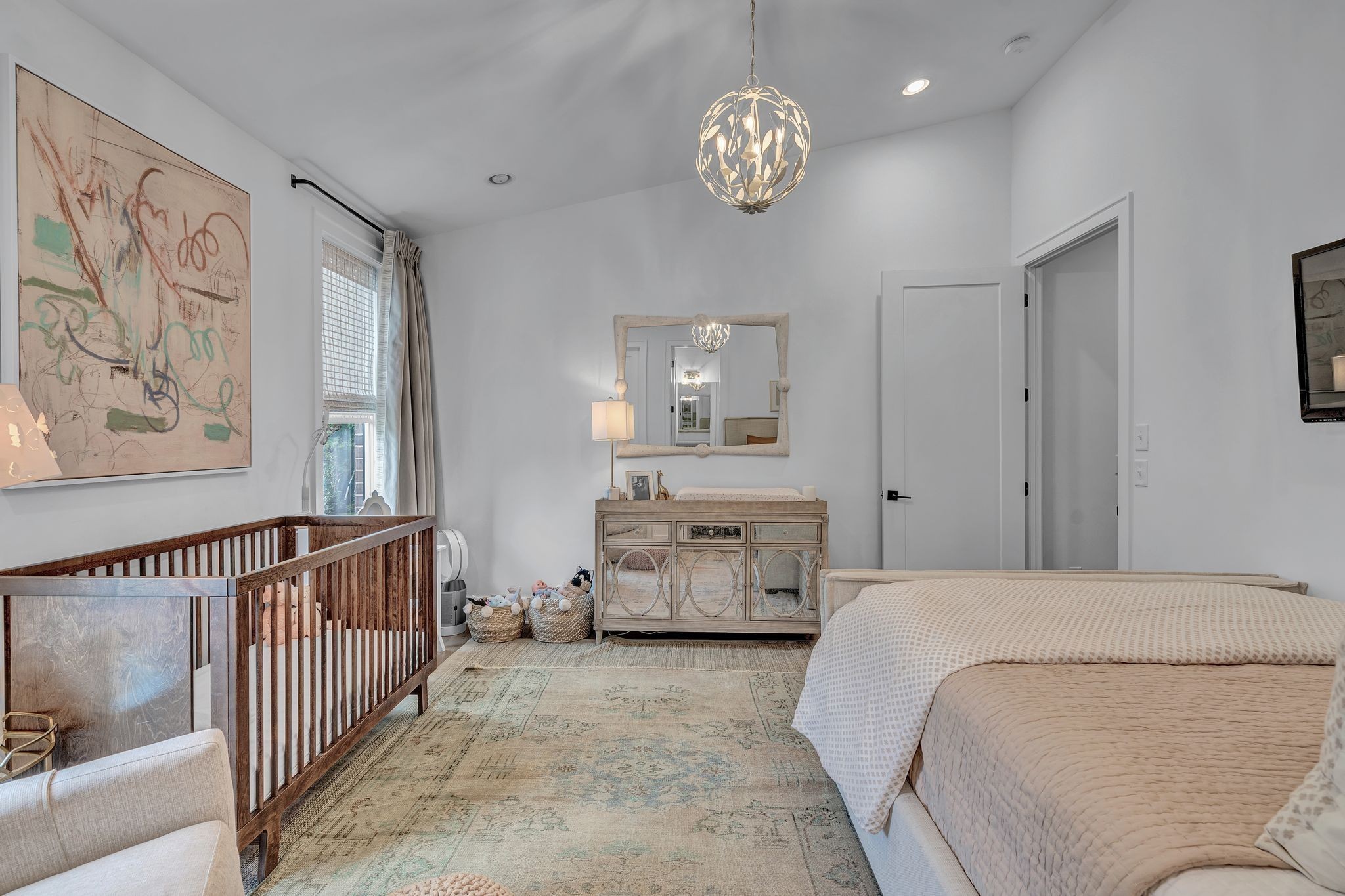 6029 Sedberry Road Nashville, TN 37205 - Photo 35 of 68 a bedroom with a large bed and a chandelier