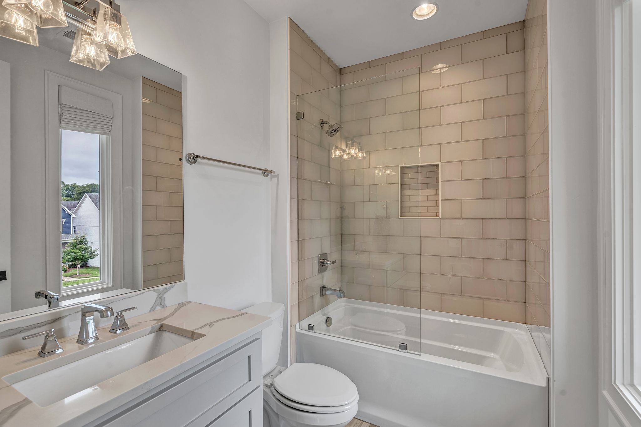 6029 Sedberry Road Nashville, TN 37205 - Photo 45 of 68 a bathroom with a bathtub shower sink vanity mirror and toilet