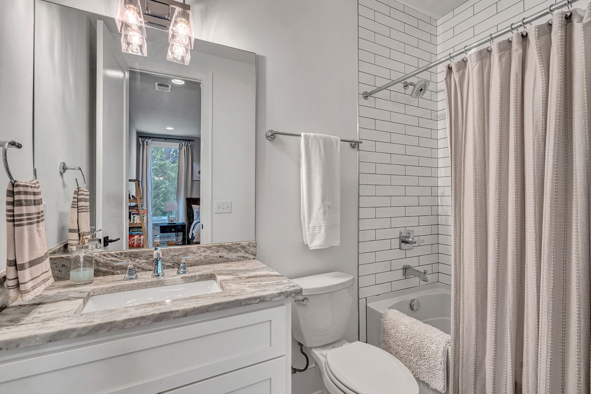6029 Sedberry Road Nashville, TN 37205 - Photo 47 of 68 a bathroom with a granite countertop sink toilet and shower
