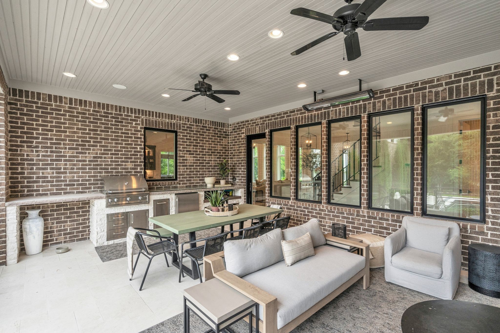 6029 Sedberry Road Nashville, TN 37205 - Photo 51 of 68 a living room with furniture floor to ceiling window and a flat screen tv