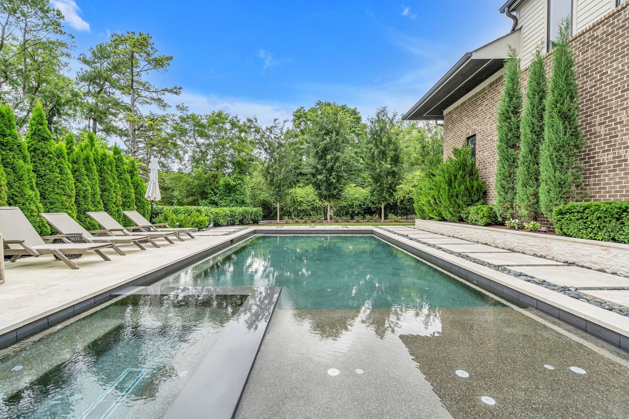 6029 Sedberry Road Nashville, TN 37205 - Photo 54 of 68 a view of a swimming pool with a yard and plants