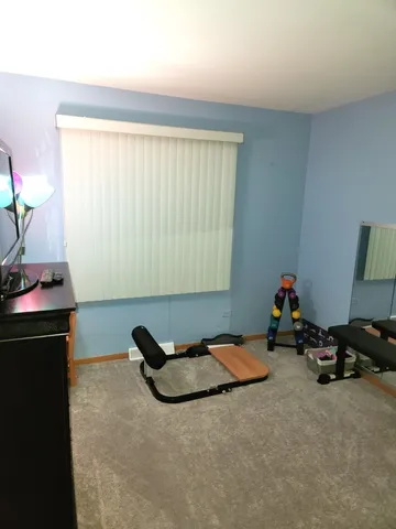 a bed room with furniture and a window