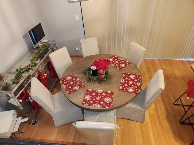 a view of a room with furniture and wooden floor