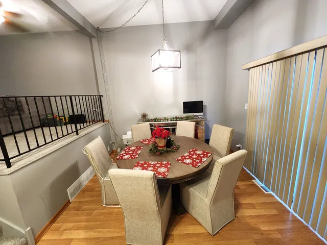 a dining room with furniture and window