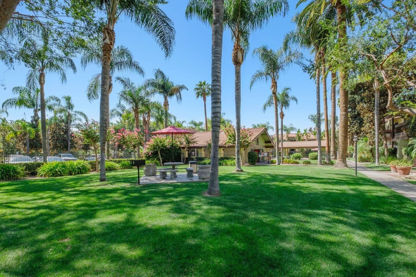 2881 Huntington Boulevard, Unit 225 Fresno, CA 93721 - Photo 1 of 16 a view of a park with a palm tree
