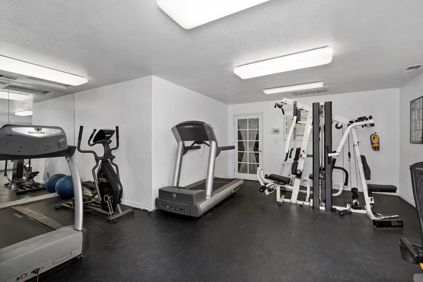 2881 Huntington Boulevard, Unit 225 Fresno, CA 93721 - Photo 14 of 16 a view of a room with gym equipment