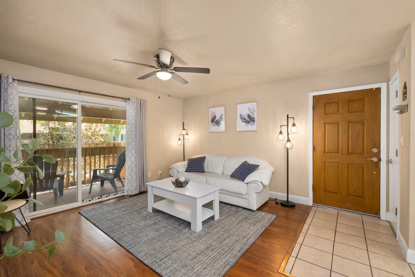 2881 Huntington Boulevard, Unit 225 Fresno, CA 93721 - Photo 5 of 16 a living room with furniture and a rug