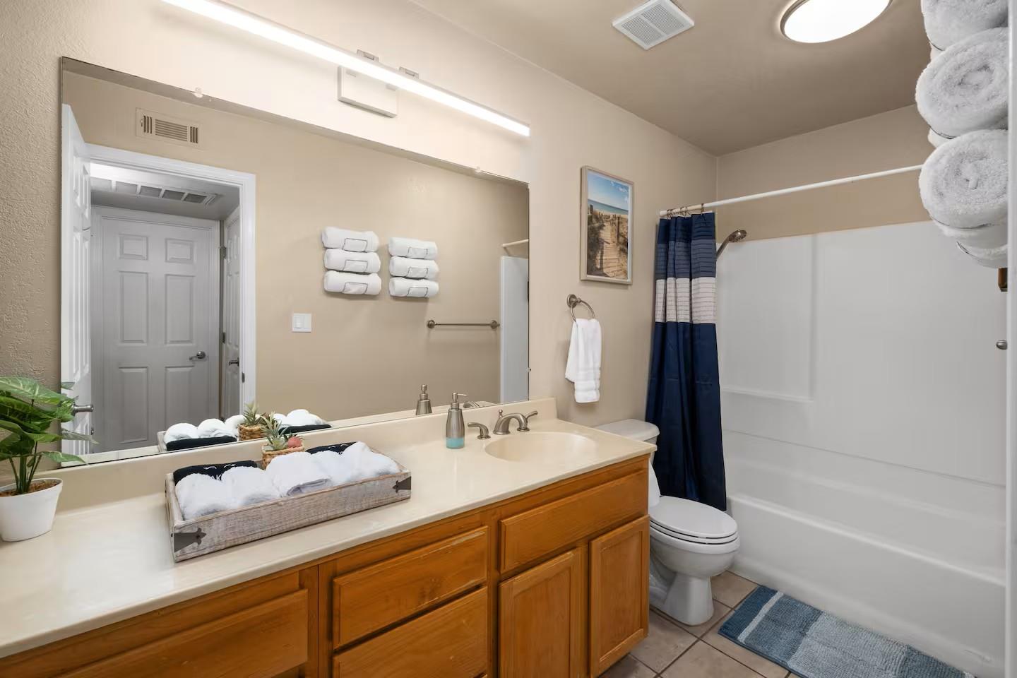 2881 Huntington Boulevard, Unit 225 Fresno, CA 93721 - Photo 8 of 16 a bathroom with a sink a toilet and shower