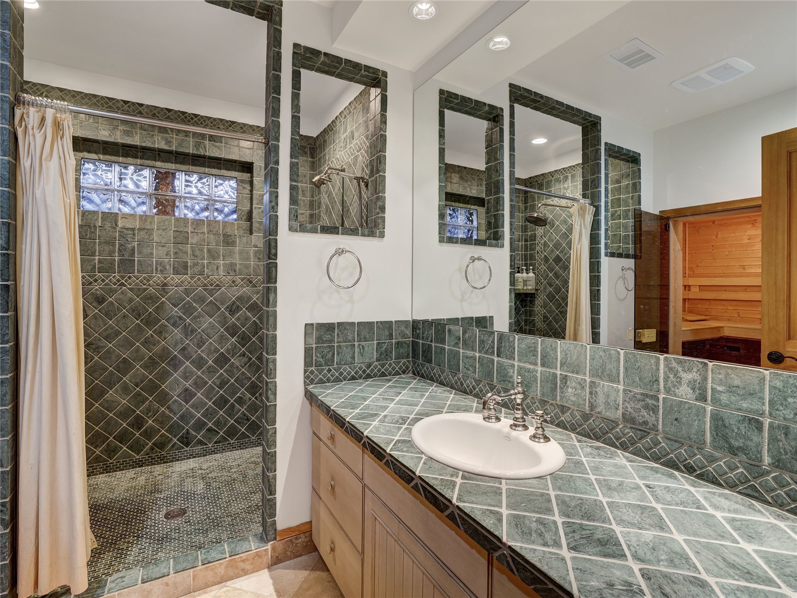 840 Penstemon Road Keystone, CO 80435 - Photo 36 of 50 Bathroom with vanity, tiled shower, and recessed lighting