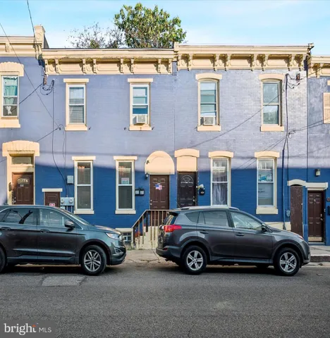 a car parked in front of a house