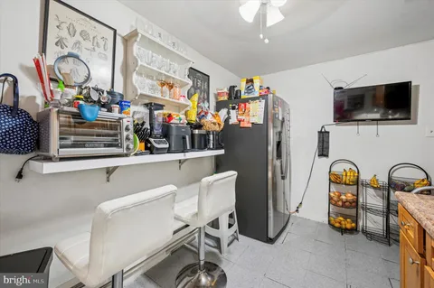 a view of dining room with furniture and flat screen tv