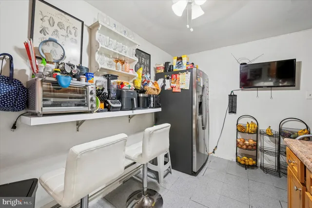 a view of dining room with furniture and flat screen tv