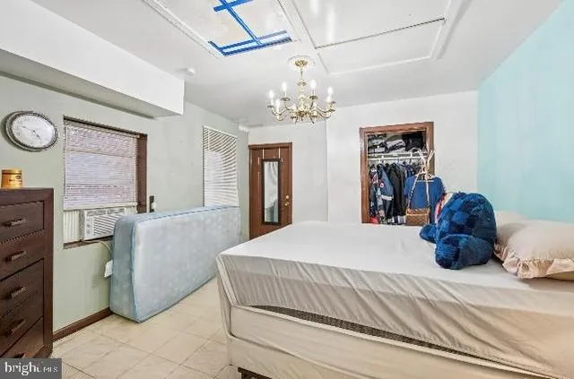 a bedroom with a bed and dresser