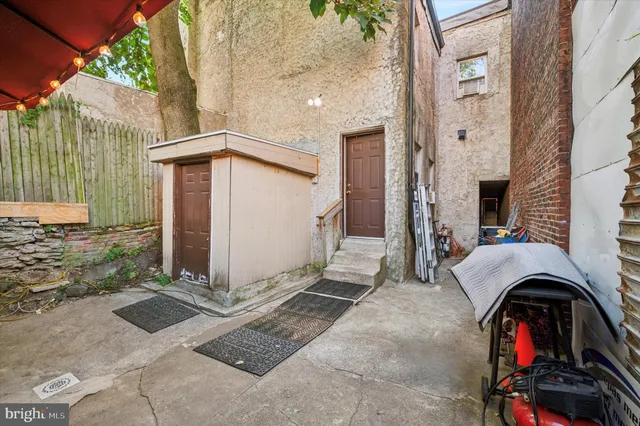 a front view of a house with parking area