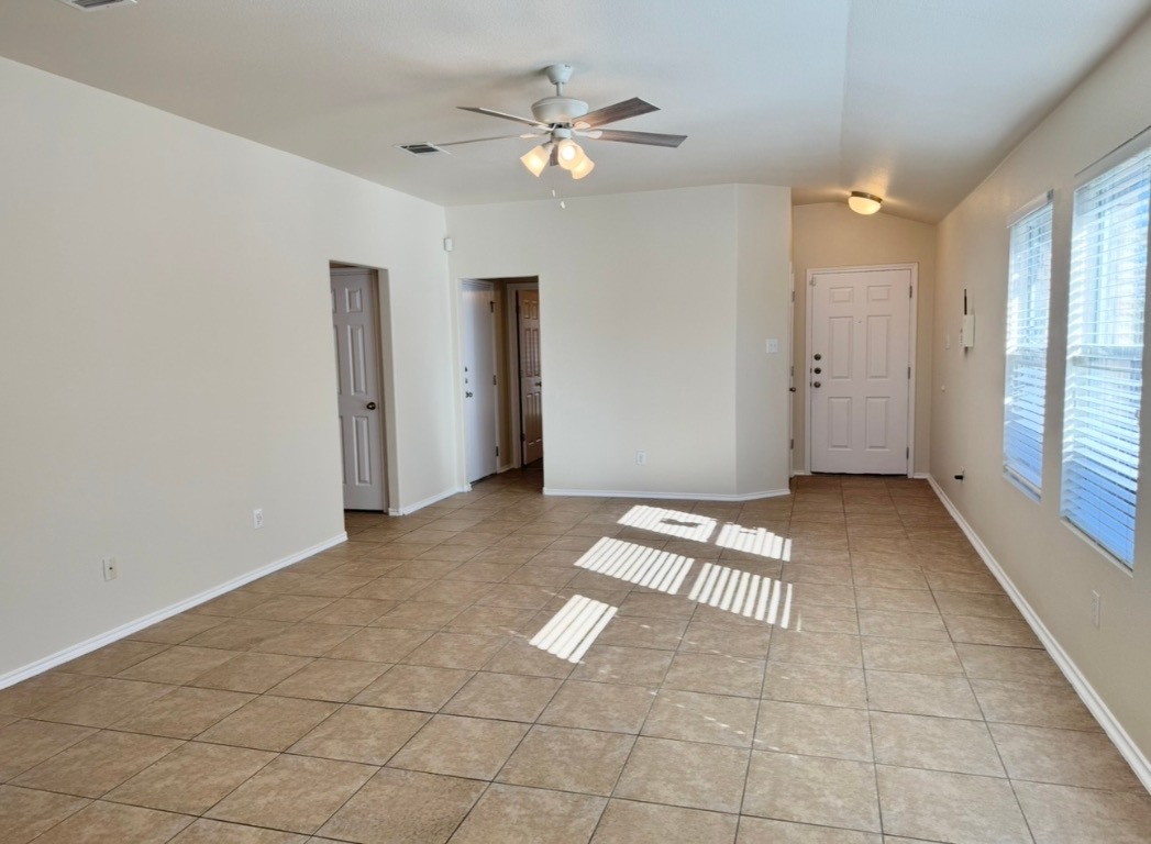 104 Gettysburg Loop Elgin, TX 78621 - Photo 8 of 26 Spare room featuring light tile patterned floors and a ceiling fan