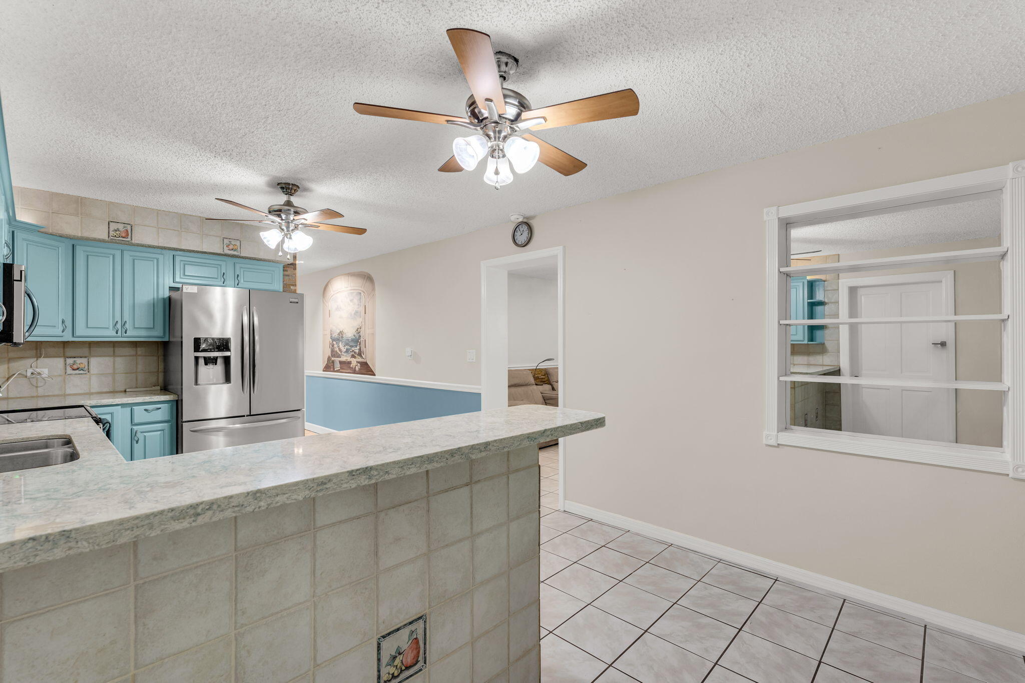 335 Sound Drive Key Largo, FL 33037 - Photo 12 of 45 a kitchen with stainless steel appliances granite countertop a sink a refrigerator and a counter space