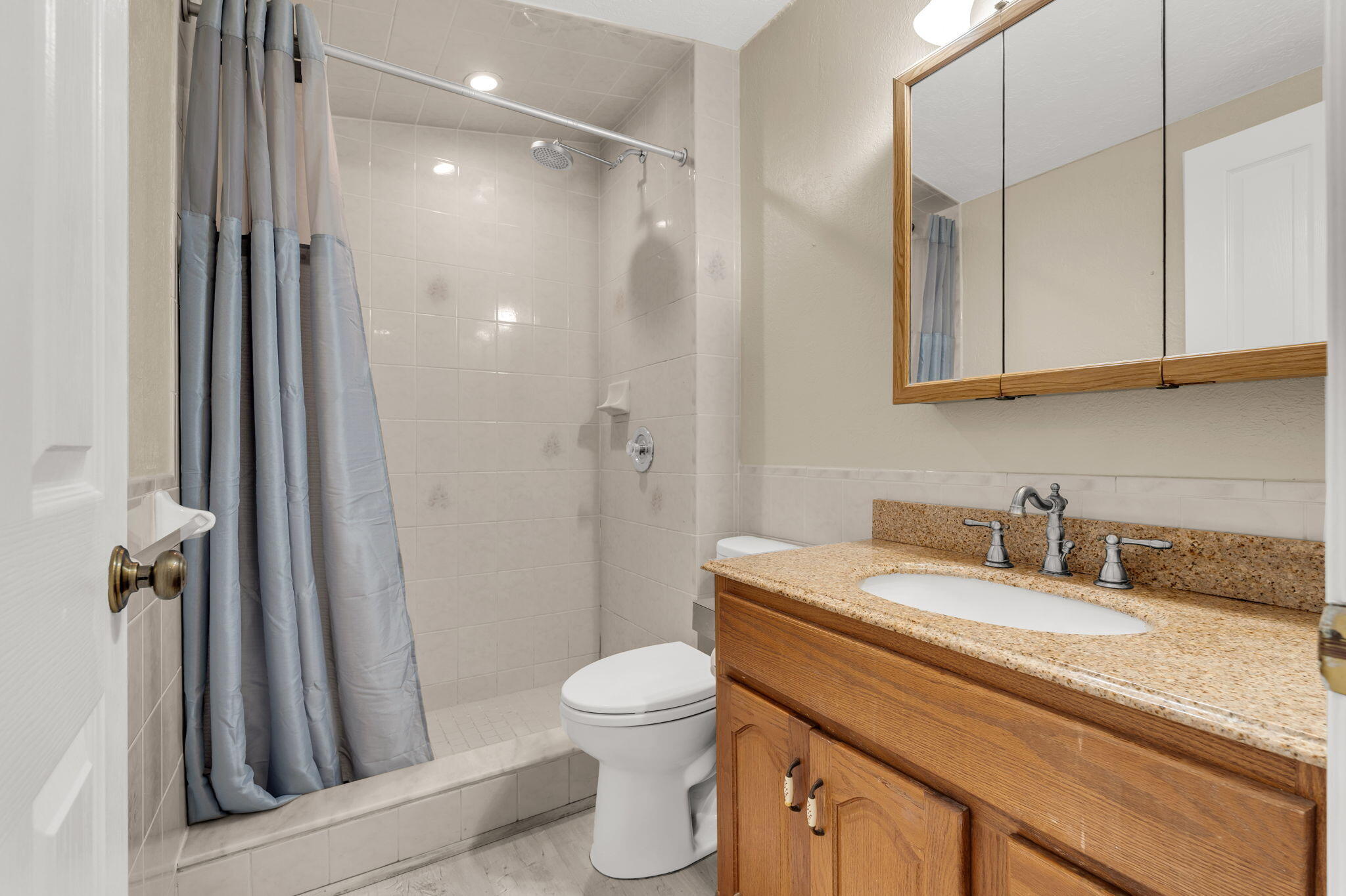 335 Sound Drive Key Largo, FL 33037 - Photo 27 of 45 a bathroom with a granite countertop sink a toilet and a shower