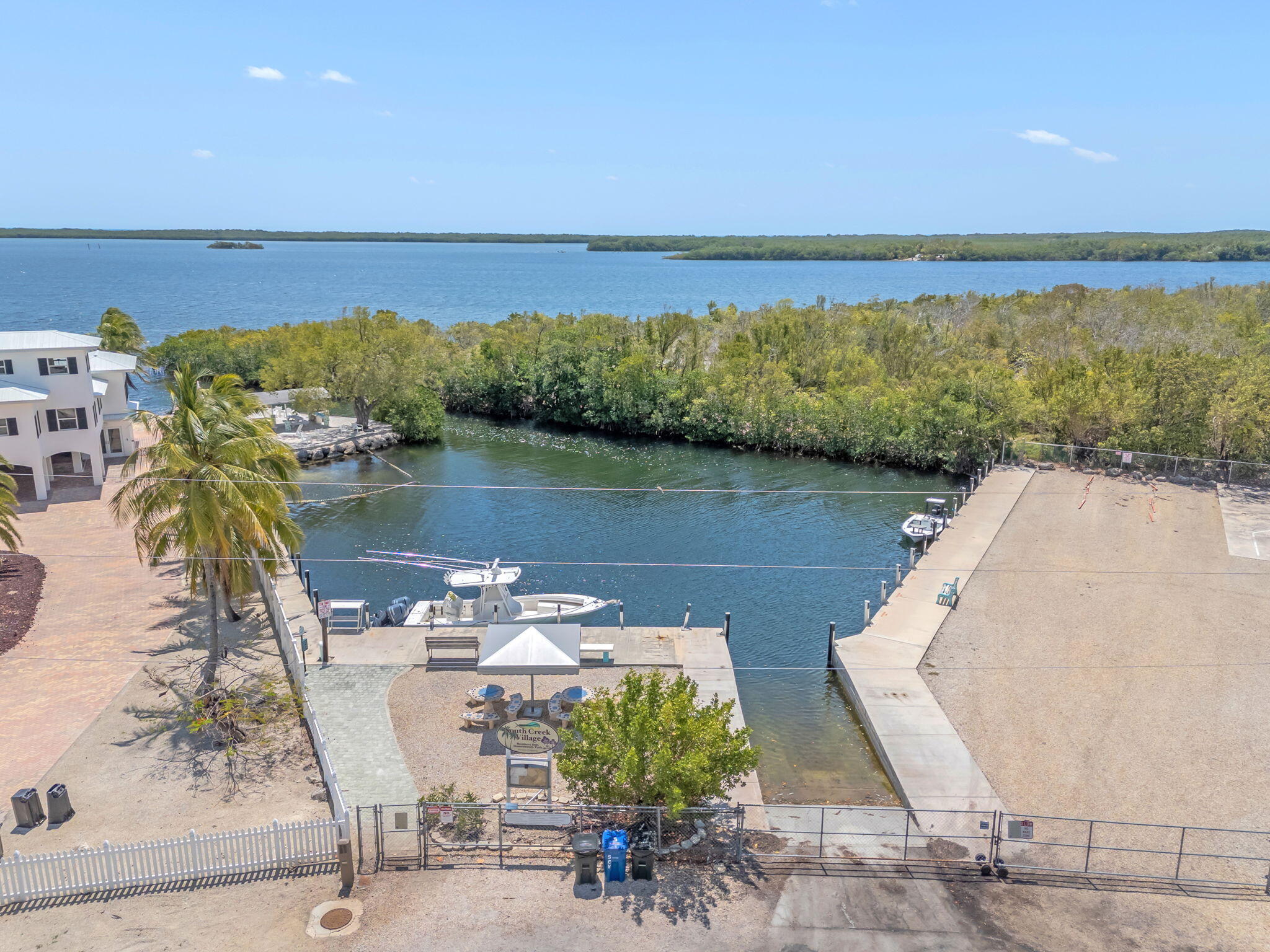 335 Sound Drive Key Largo, FL 33037 - Photo 45 of 45 a view of a lake with couches in the back yard