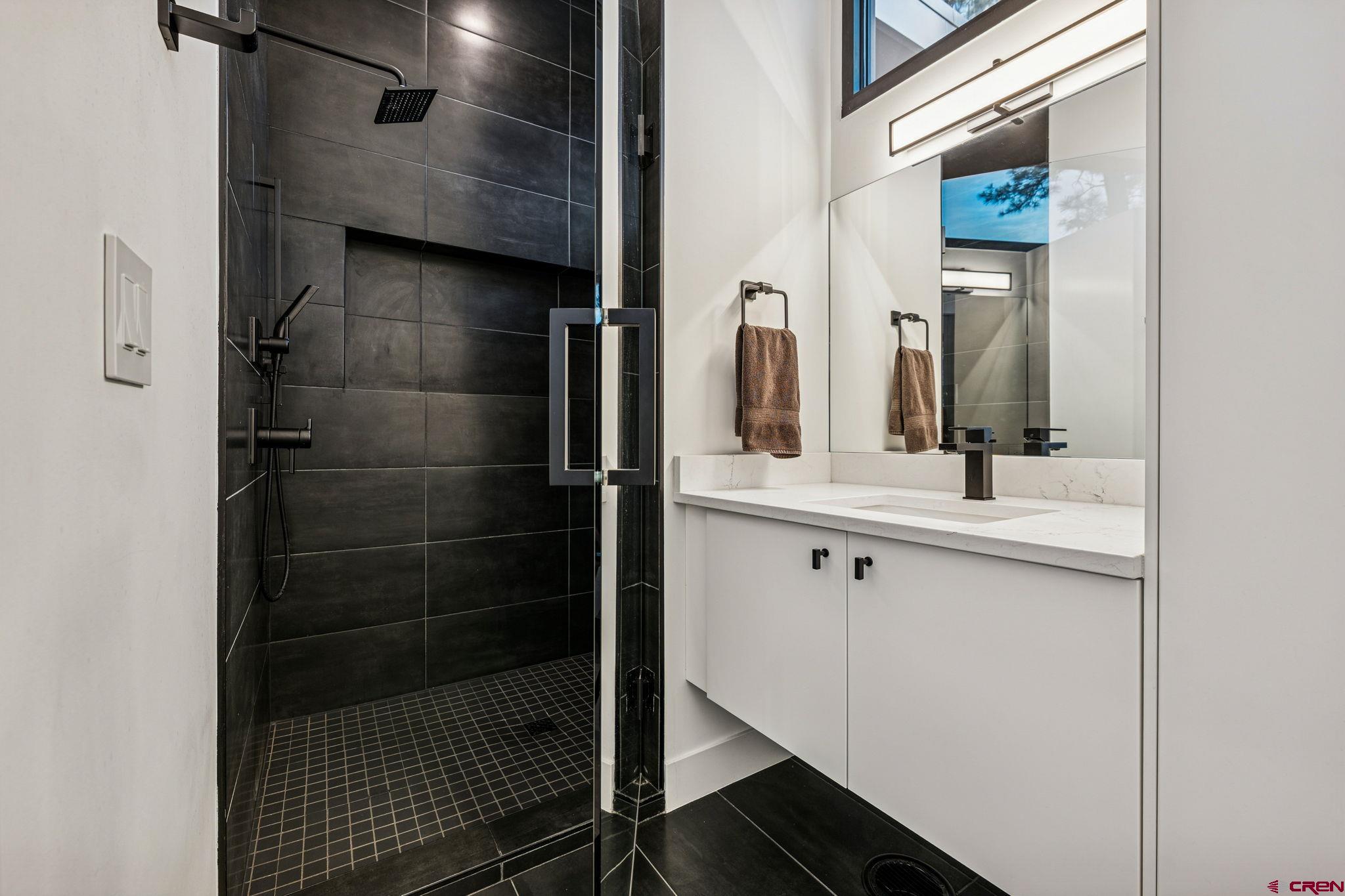 55 Bell Flower Court Durango, CO 81301 - Photo 17 of 44 a bathroom with a shower and a sink