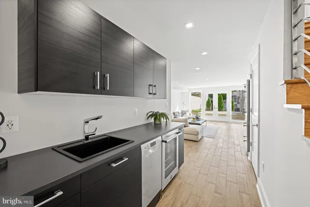 a kitchen with a sink and cabinets