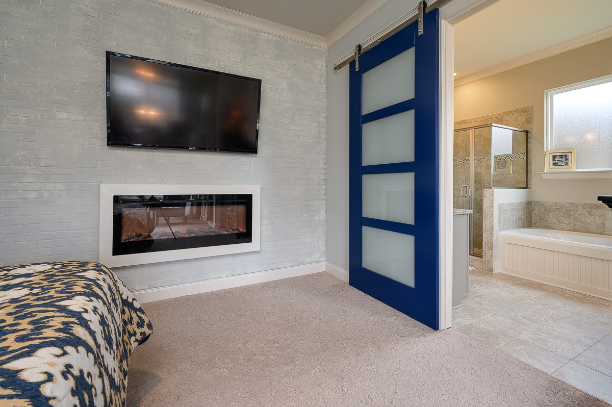 472 River Bluff Drive Franklin, TN 37064 - Photo 15 of 34 a living room with a flat screen tv and a fireplace