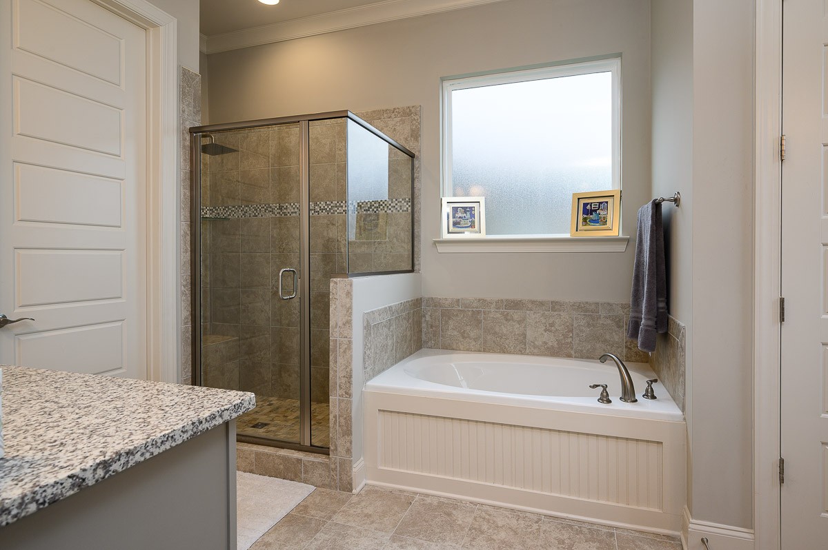 472 River Bluff Drive Franklin, TN 37064 - Photo 16 of 34 a bathroom with a tub and a shower
