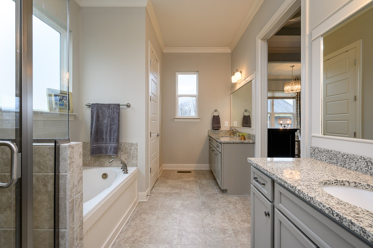 472 River Bluff Drive Franklin, TN 37064 - Photo 17 of 34 a bathroom with a granite countertop sink a toilet and bathtub