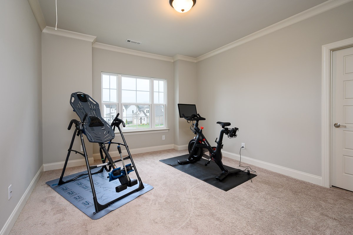 472 River Bluff Drive Franklin, TN 37064 - Photo 19 of 34 a room with gym equipment and windows
