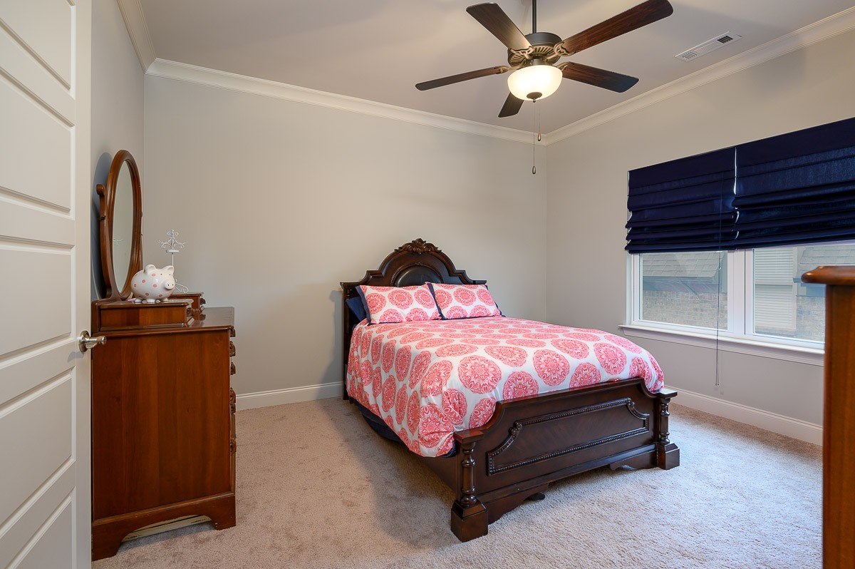 472 River Bluff Drive Franklin, TN 37064 - Photo 23 of 34 a bedroom with a bed and a chandelier