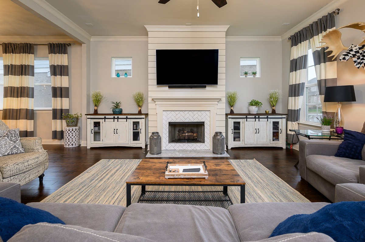 472 River Bluff Drive Franklin, TN 37064 - Photo 5 of 34 a living room with furniture a flat screen tv and a fireplace