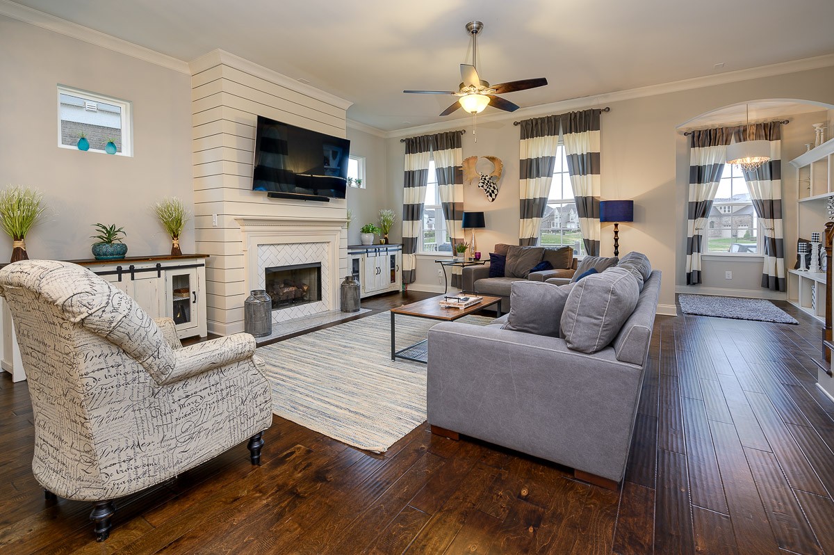 472 River Bluff Drive Franklin, TN 37064 - Photo 6 of 34 a living room with furniture a flat screen tv and a fireplace