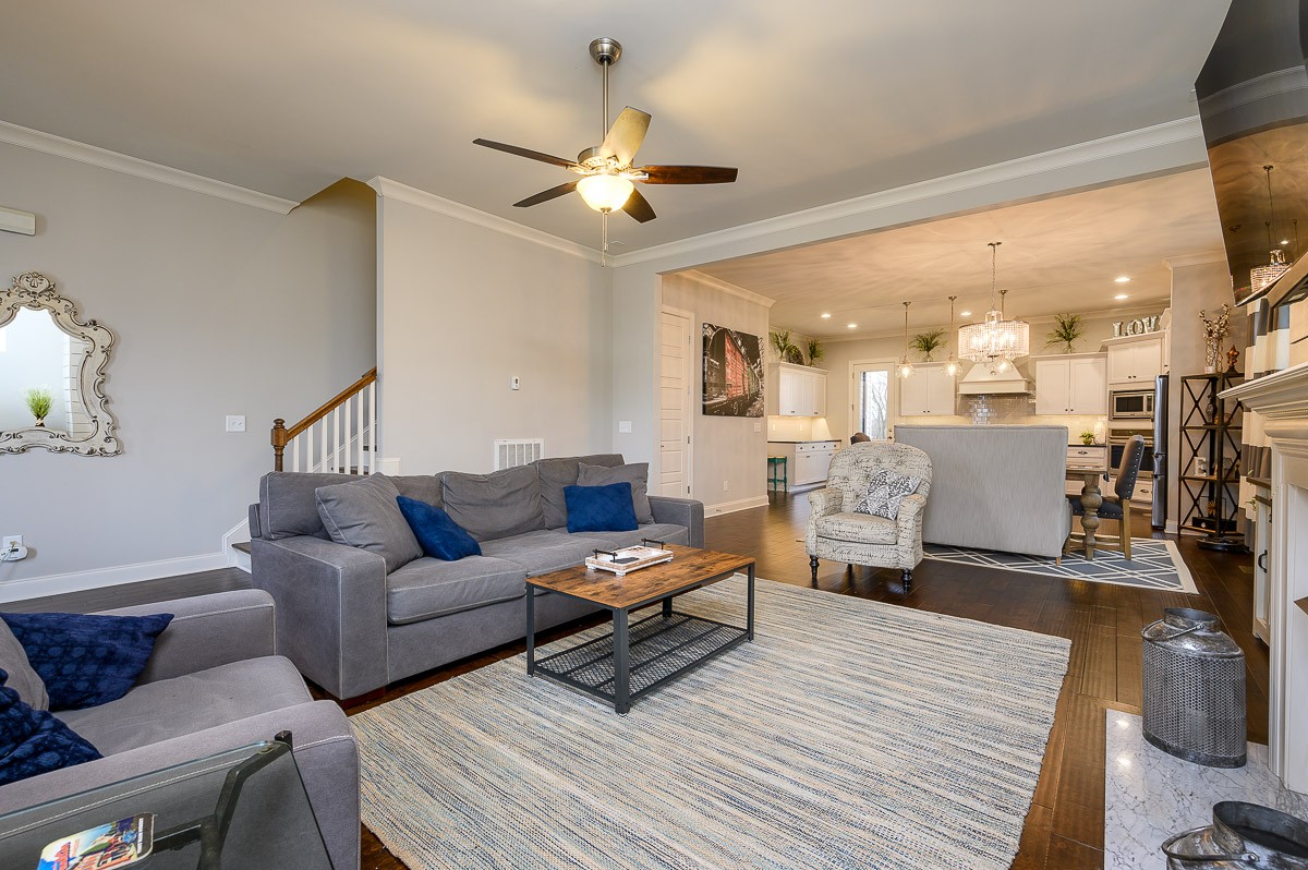 472 River Bluff Drive Franklin, TN 37064 - Photo 7 of 34 a living room with furniture and a chandelier
