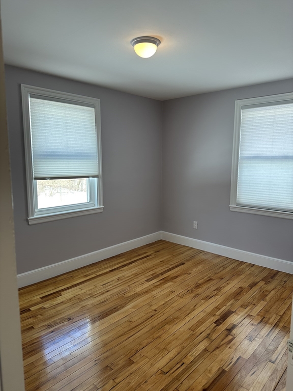 33 Paragon Road Boston, MA 02132 - Photo 8 of 8 a view of empty room with wooden floor and fan
