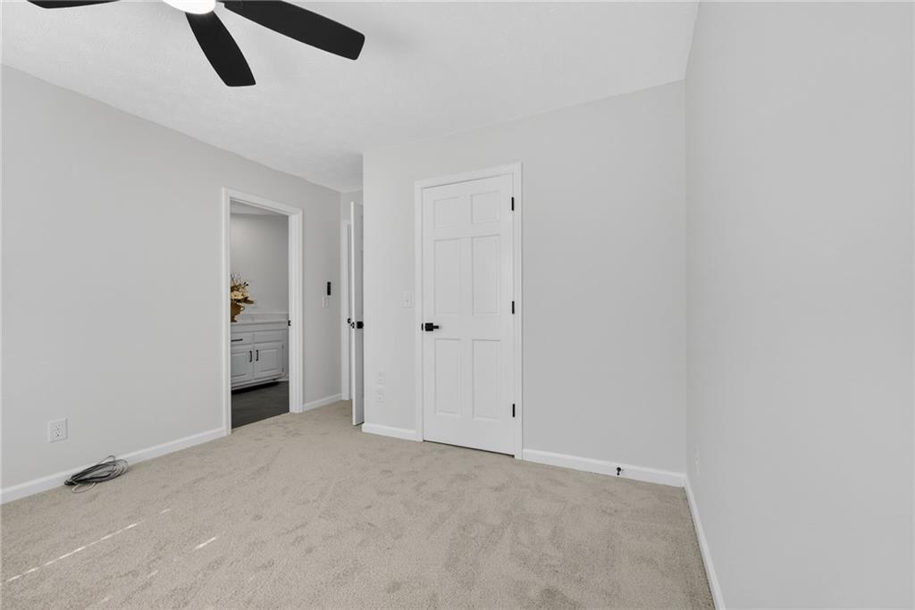 601 Cobblestone Lane Stone Mountain, GA 30087 - Photo 46 of 69 a view of an empty room