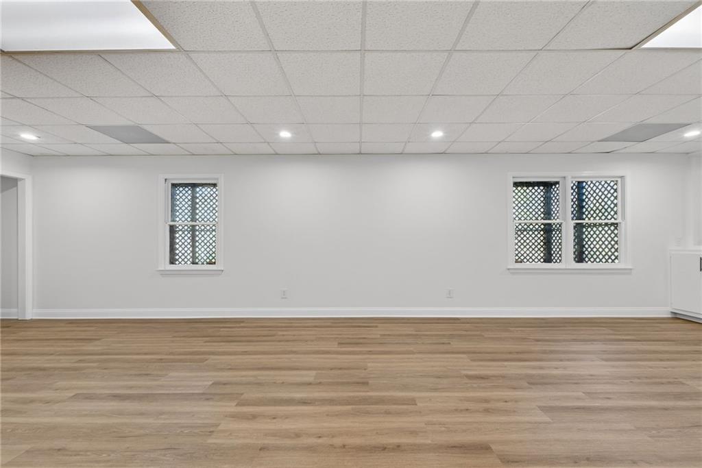 601 Cobblestone Lane Stone Mountain, GA 30087 - Photo 49 of 69 a view of an empty room with window and wooden floor