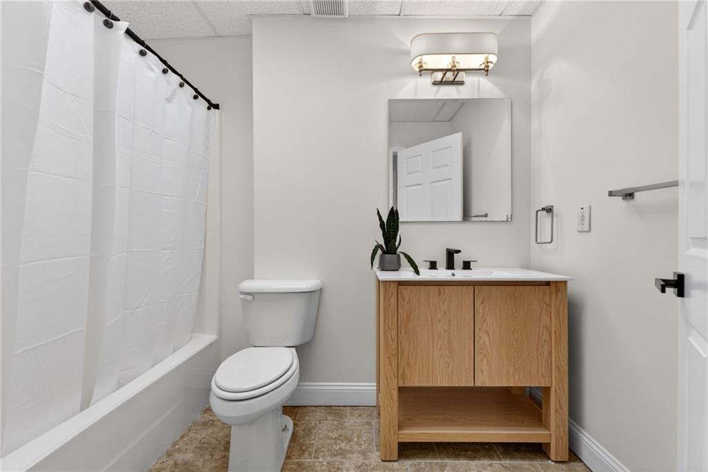 601 Cobblestone Lane Stone Mountain, GA 30087 - Photo 50 of 69 a bathroom with a toilet a sink and mirror