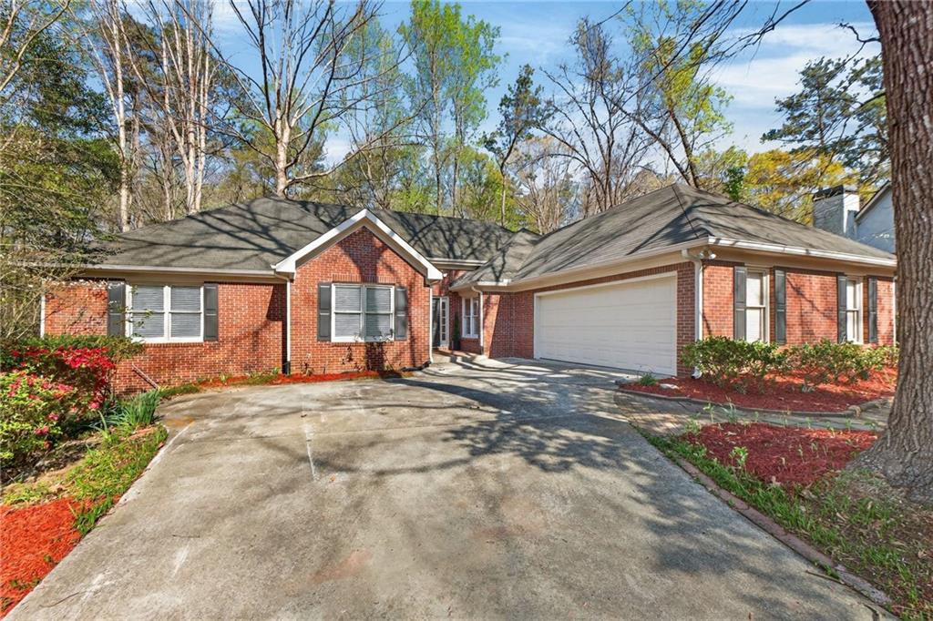 601 Cobblestone Lane Stone Mountain, GA 30087 - Photo 5 of 69 a view of a house with a yard and tree s
