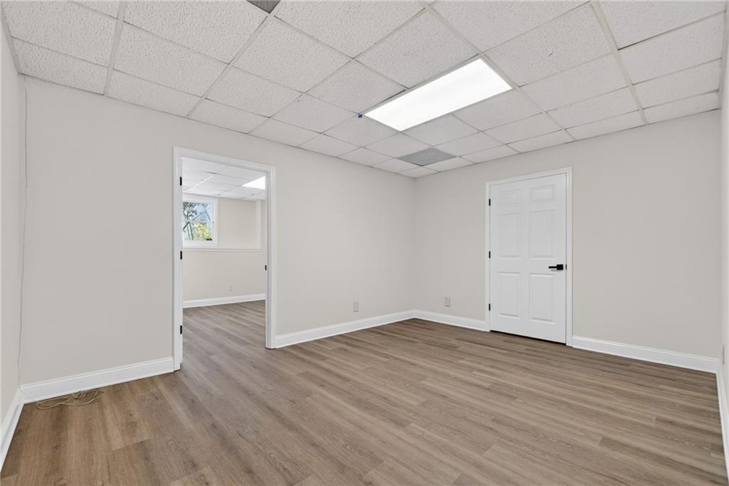 601 Cobblestone Lane Stone Mountain, GA 30087 - Photo 51 of 69 a view of an empty room with wooden floor
