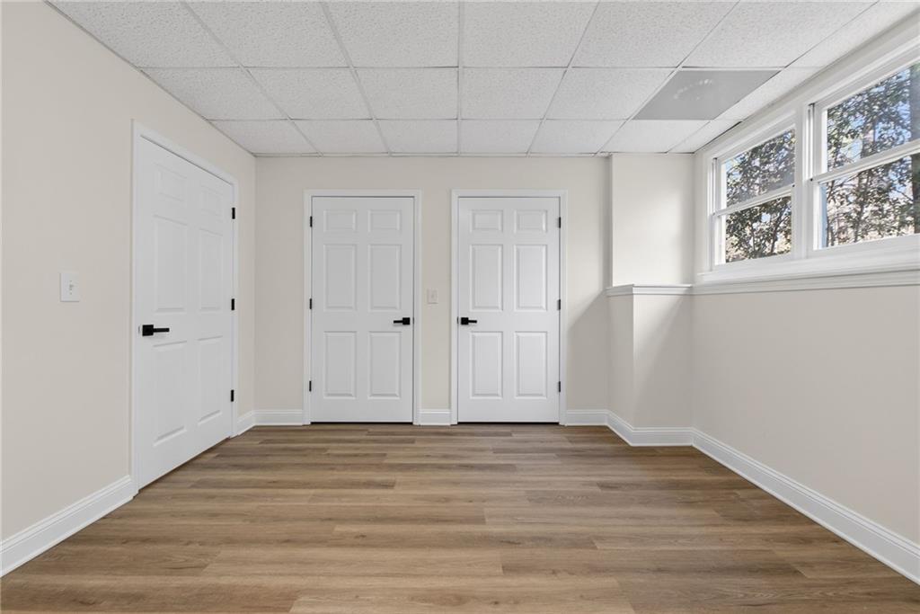 601 Cobblestone Lane Stone Mountain, GA 30087 - Photo 53 of 69 a view of an empty room with wooden floor