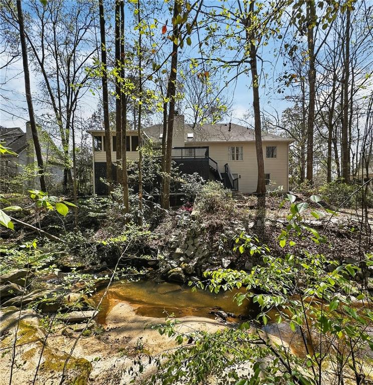 601 Cobblestone Lane Stone Mountain, GA 30087 - Photo 60 of 69 a backyard of a house with a garden and outdoor space