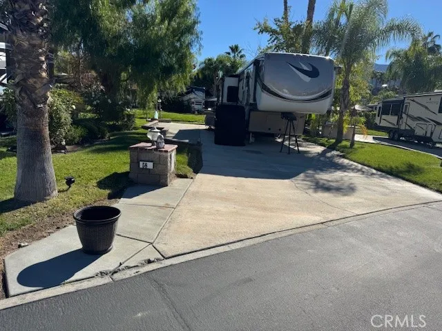 a view of a backyard with sitting area