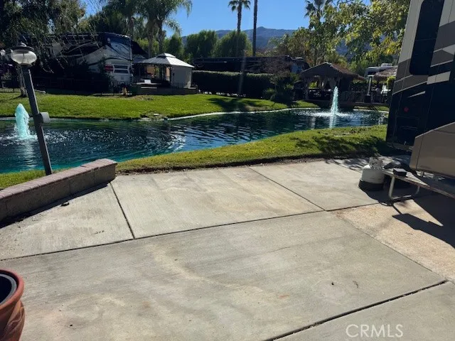 a view of backyard with plants and outdoor seating