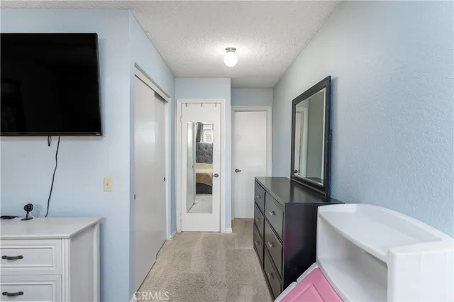 a view of a kitchen from the hallway