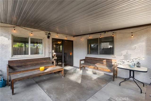 a backyard of a house with outdoor seating