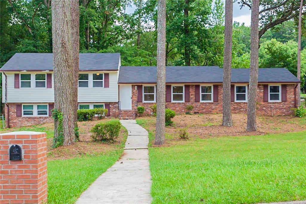 3492 Revere Road Southwest Atlanta, GA 30331 - Photo 1 of 1 front view of a house with a yard