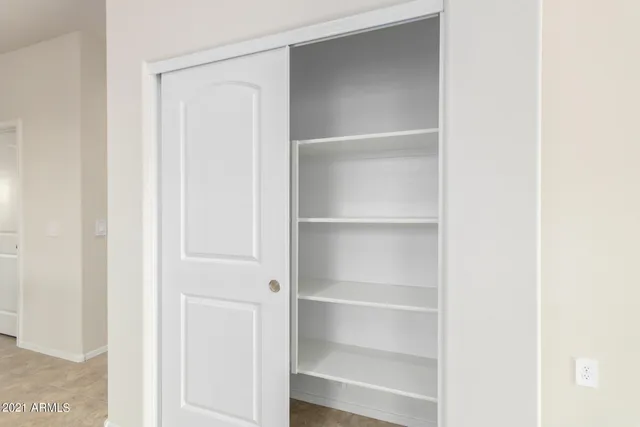 a kitchen with stainless steel appliances granite countertop a sink counter space cabinets and a large mirror