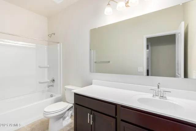 a view of a house with a snow on the road