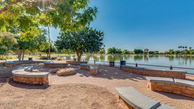 a view of a swimming pool with an outdoor space and seating area