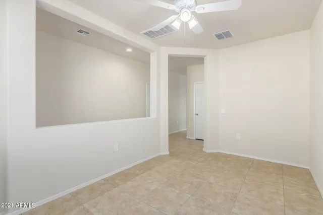a view of a hallway with a dining area
